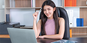 Young professional completing online data entry tasks and earning income while studying.
