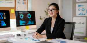 Team of business analysts reviewing data reports during a meeting