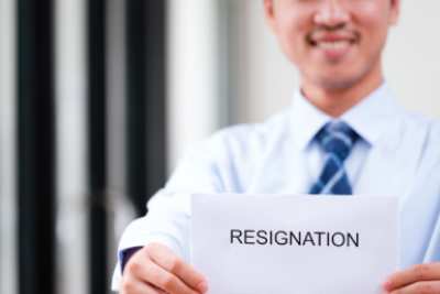 Man handing over a resignation letter email, demonstrating professional resignation